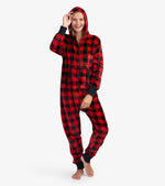 Woman in unisex buffalo plaid fleece jumpsuit with hood, shop ladies clothes at Pazazz